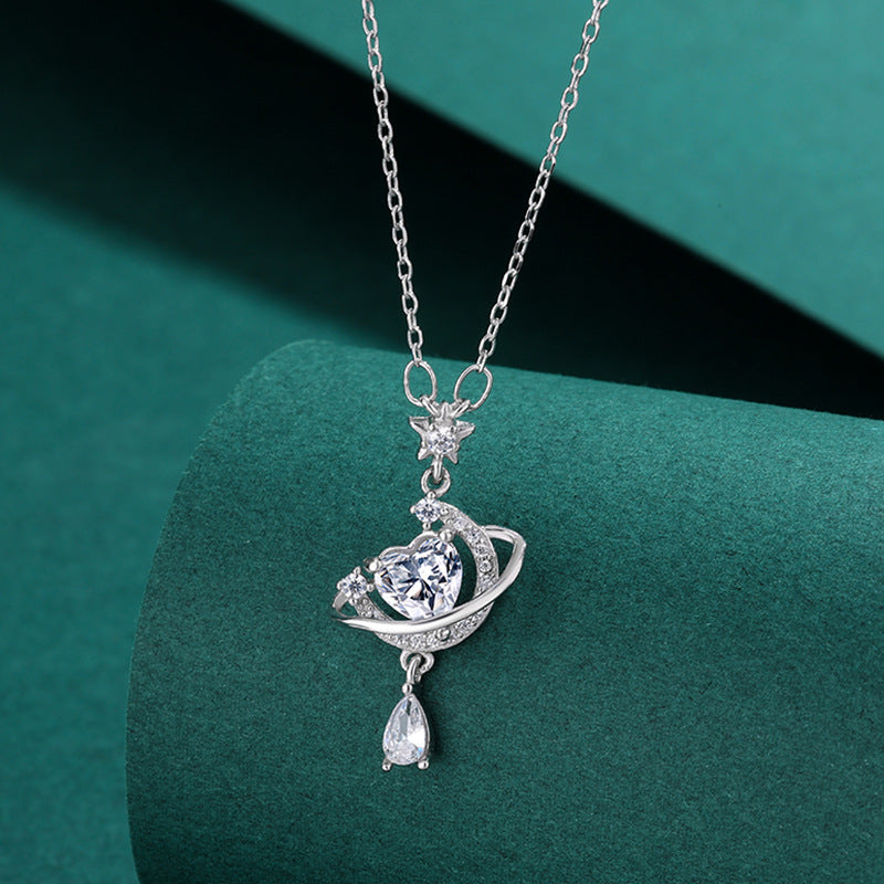 Sparkling Celestial Heart Planet Pendant Necklace on display