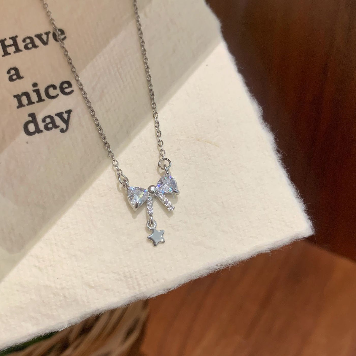 Sparkling Crystal Bow & Star Pendant Necklace