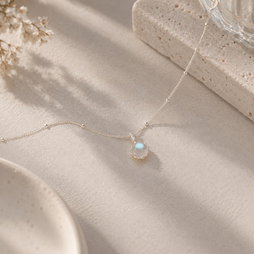 Sparkling Aurora Moonstone Pendant Satellite Necklace flat lay