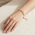 Rose Quartz Clover Adjustable Bolo Bracelet worn on wrist